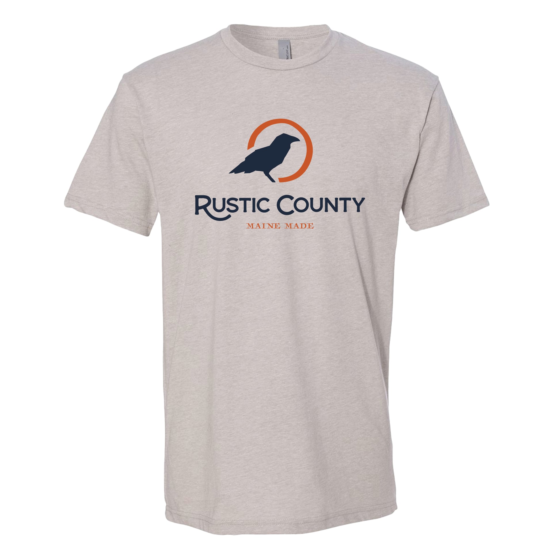 A lightweight fit, light gray Rustic County unisex short sleeve t-shirt with the logo "rustic county maine made" featuring a stylized bird in blue and orange colors on the chest area.
