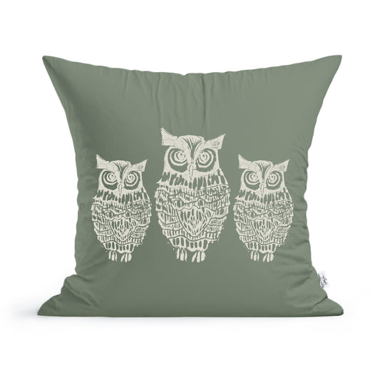 The Rustic County Hooty Owls Pillow is a green cushion with a white design of three stylized owls in a row, detailed feather and facial patterns, and made from 100% cotton—perfect as a cozy owl lover accessory.