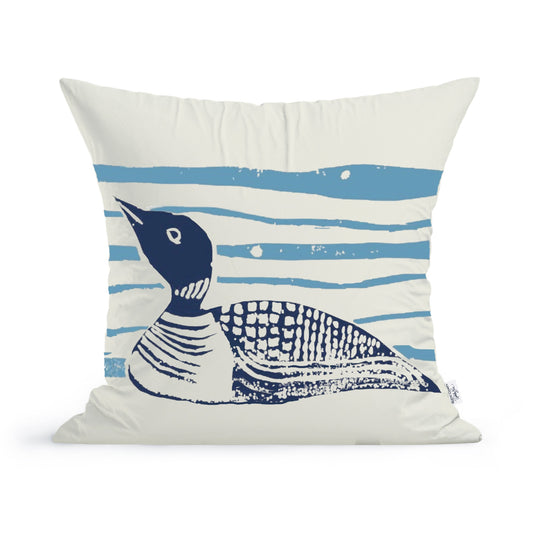 The Rustic County Maine Loon on the Lake Pillow is a 100% cotton decorative pillow, featuring a stylized dark blue loon set against horizontal light blue stripes on a white background.