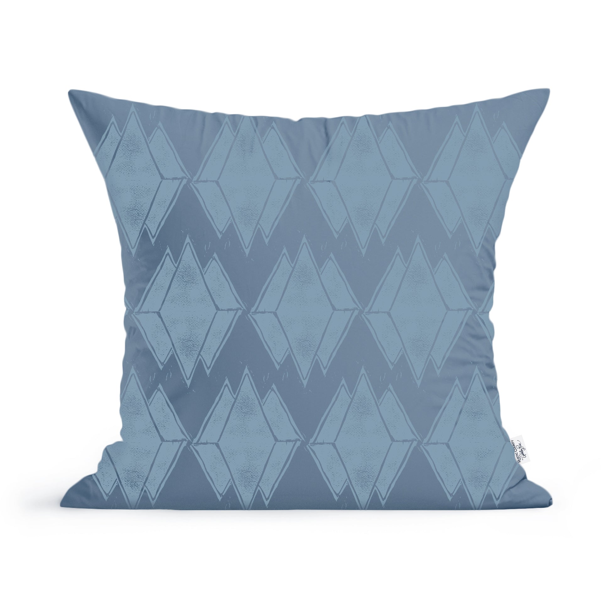 A Rustic County Maine Mountain Reflections Pillow with a geometric pattern in shades of blue, featuring a series of repeated diamond and triangular shapes. The background is a light blue with slightly darker blue designs, ideal for modern home decor.