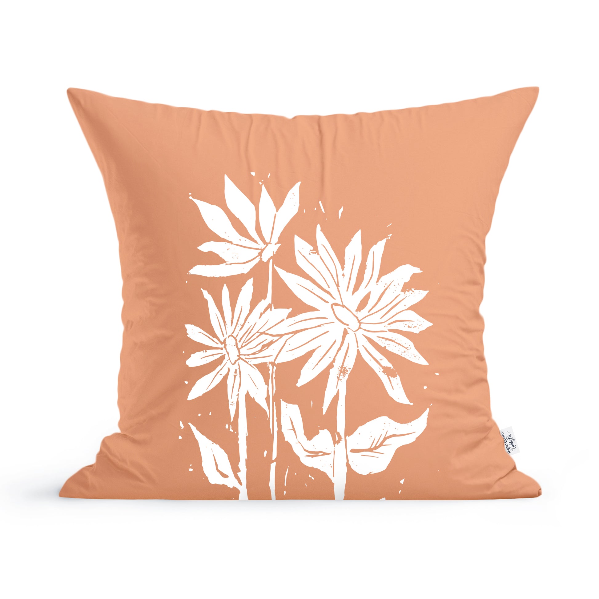 Decorative Sunflowers Pillow with a peach background featuring a white sunflower print design by Rustic County.
