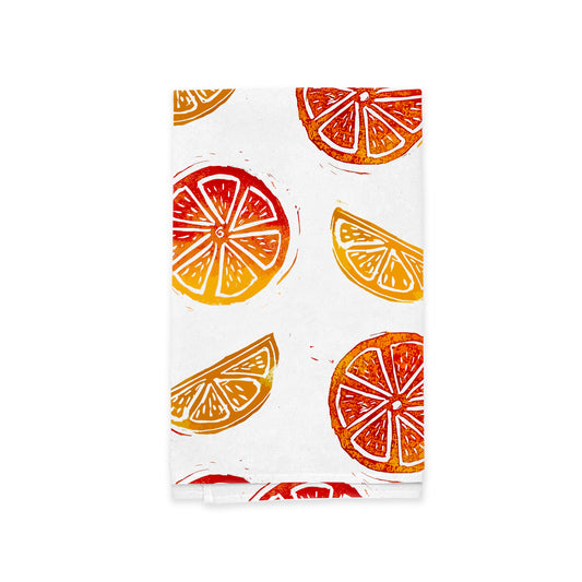A Rustic County Sunny Citrus Kitchen Tea Towel featuring a colorful print of orange and lemon slices against a white background, with a slightly distressed texture.