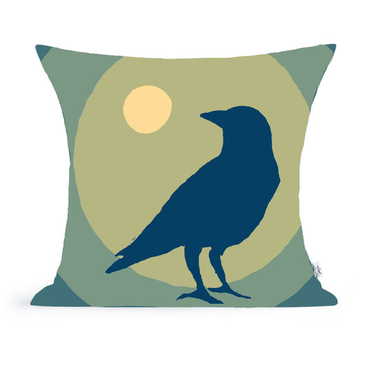 The Moonstruck Crow Pillow by Rustic County features a dark blue crow silhouette on a muted green and yellow background with a sun, crafted from soft 100% cotton—an eye-catching piece of home decor.
