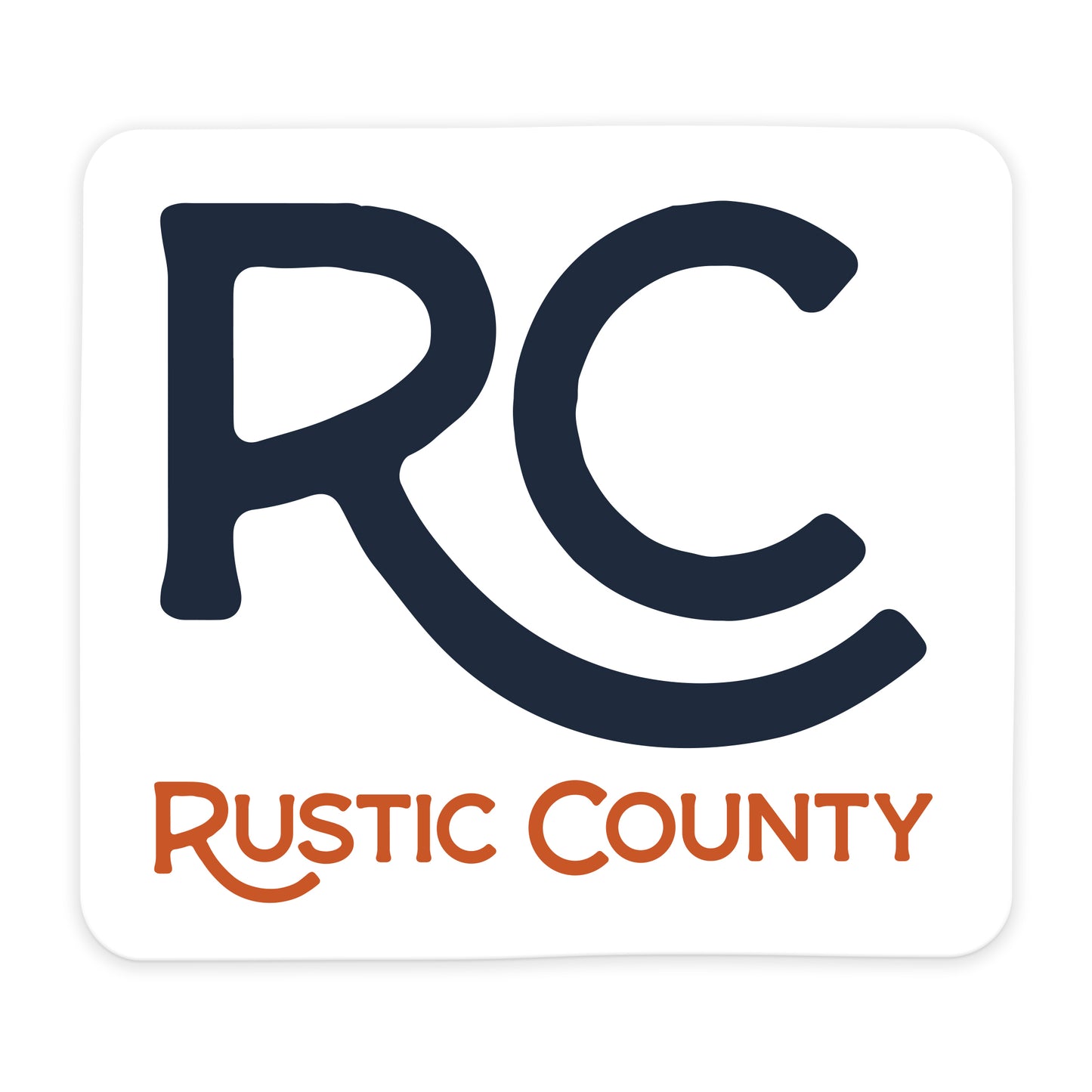 Rustic County Icon Sticker featuring the stylized initials "rc" in large navy blue letters, with the full name in smaller orange font below on a waterproof sticker.