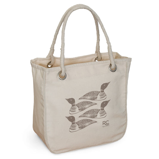 A beige Maine Loon Rope Tote standing upright with three stylized black birds printed on the front. The bag features sturdy rope handles.
